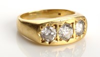 Lot 836 - A three stone diamond ring, the central stone...