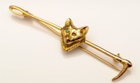 Lot 845 - A 9ct. gold fox and riding crop pattern brooch,...