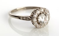 Lot 846 - A diamond cluster ring, the central diamond...