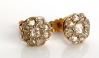 Lot 849 - A pair of diamond cluster earrings, each with...