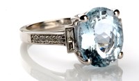 Lot 852 - An aquamarine and diamond ring, the oval...