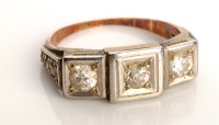 Lot 853 - A diamond ring, the top set with three...