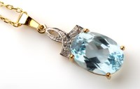 Lot 855 - A blue topaz and diamond pendant, the central...