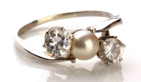 Lot 862 - A pearl and diamond ring, the central pearl...