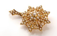 Lot 863 - A diamond and seed pearl snowflake pattern...