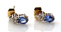 Lot 864 - A pair of blue stone and diamond ear studs,...