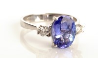 Lot 870 - A tanzanite and diamond ring, the oval cut...