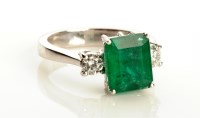 Lot 871 - An emerald and diamond ring, the central...