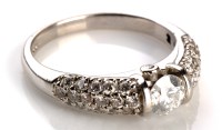 Lot 881 - A diamond ring, the central brilliant cut...