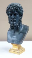 Lot 972 - A cast metal bust depicting a bearded...