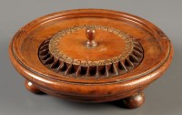 Lot 986 - An early 19th Century treen roulette wheel,...