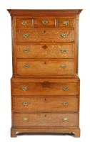 Lot 1041 - A late Georgian oak tallboy, with flared...