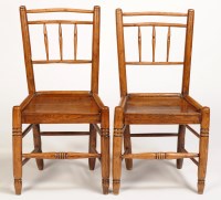 Lot 1047 - A set of four single elm solid seat chairs...