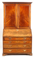 Lot 1051 - A George III mahogany bureau bookcase with a...
