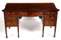 Lot 1060 - A mahogany kneehole dressing table, by Druce &...