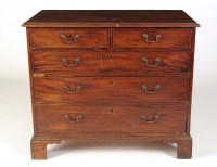 Lot 1061 - A late Georgian mahogany chest of two short...