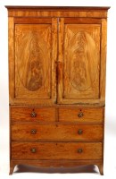 Lot 1067 - A George IV mahogany wardrobe with a flared...