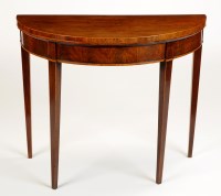 Lot 1074 - A George III mahogany semi circular card table,...