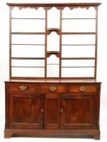 Lot 1076 - A late Georgian oak dresser, with three-tier...