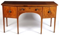 Lot 1080 - A Georgian mahogany bowfront sideboard, fitted...