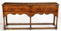 Lot 1099 - An 18th Century oak dresser, fitted two short...