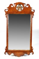 Lot 1127 - A Georgian walnut parcel gilt wall mirror,...