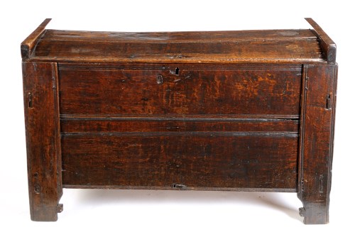 Lot 1128 - A 17th Century plain oak coffer with plank lid...