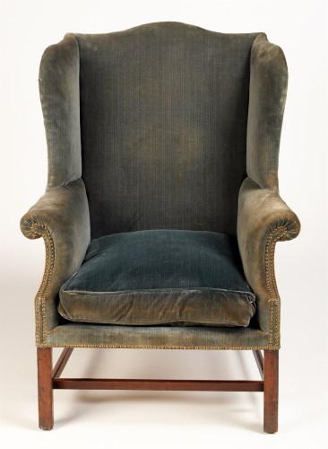 Lot 1137 - A George III mahogany wing easy chair, covered...