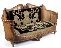 Lot 1152 - A Continental bergere beech frame settee, the...