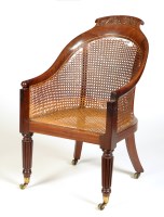 Lot 1163 - A George IV mahogany bergere armchair, the...