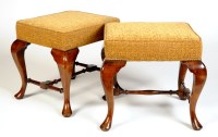 Lot 1182 - A pair of Georgian style walnut stools, the...