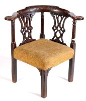 Lot 1194 - A George III mahogany corner chair, with a...