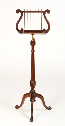 Lot 1198 - A Regency style mahogany music stand with lyre-...