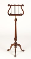 Lot 1198 - A Regency style mahogany music stand with lyre-...
