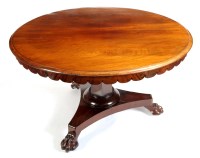 Lot 1202 - A Victorian circular mahogany tip-up-top...