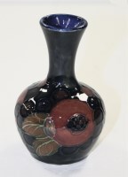 Lot 311 - William Moorcroft: a small baluster vase...