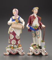 Lot 323 - A pair of figures of a gardener and companion,...