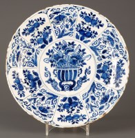 Lot 339 - An 18th Century Dutch Delft charger, decorated...