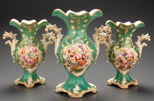 Lot 384 - A garniture of three porcelain vases, circa...