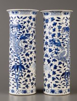Lot 393 - A pair of blue and white cylinder vases,...