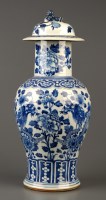Lot 394 - A blue and white covered baluster vase, 19th...