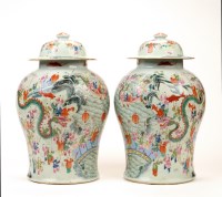 Lot 418 - A pair of baluster covered vases, the pale...
