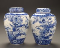 Lot 442 - A pair of blue and white covered vases,...