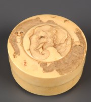 Lot 452 - A carved ivory box, the cover carved with a...