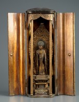 Lot 454 - A lacquer shrine, the twin doors opening to...