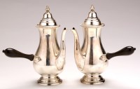 Lot 490 - A pair of George V cafe-au-lait pots, by...