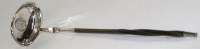 Lot 519 - A Georgian white metal toddy ladle, the oval...