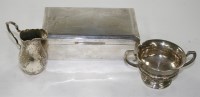 Lot 658 - An Elizabeth II engine turned cigarette box,...