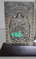 Lot 662 - A Chinese white metal plaque depicting five...