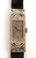 Lot 680 - An Art Deco 18ct. gold and diamond cased...